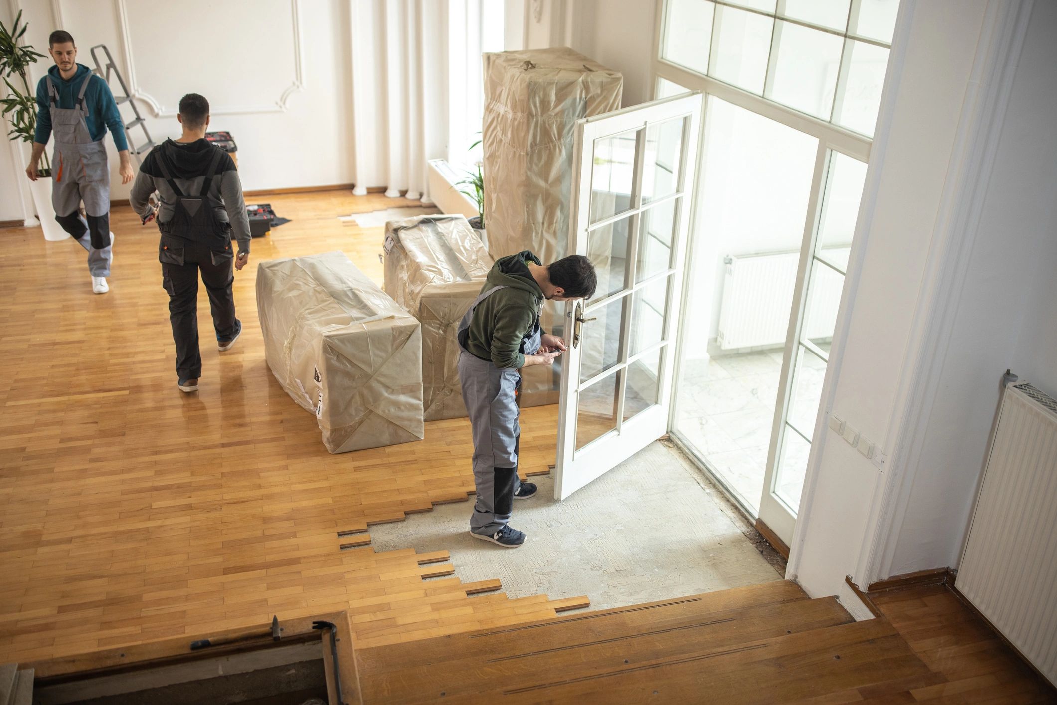Professional movers loading furniture for a home move