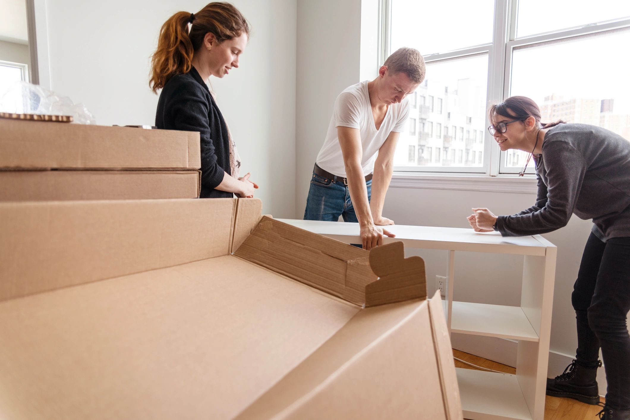 Person unpacking boxes in a new apartment